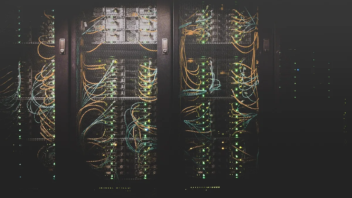 Rows of network cables in a datacentre, the shared fabric that cloud runs on