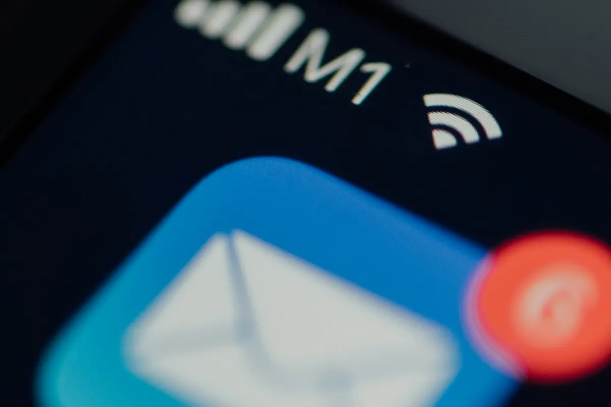 A mail app icon on a phone screen with an unread badge, the kind of client still pointed at the old server after an MX change
