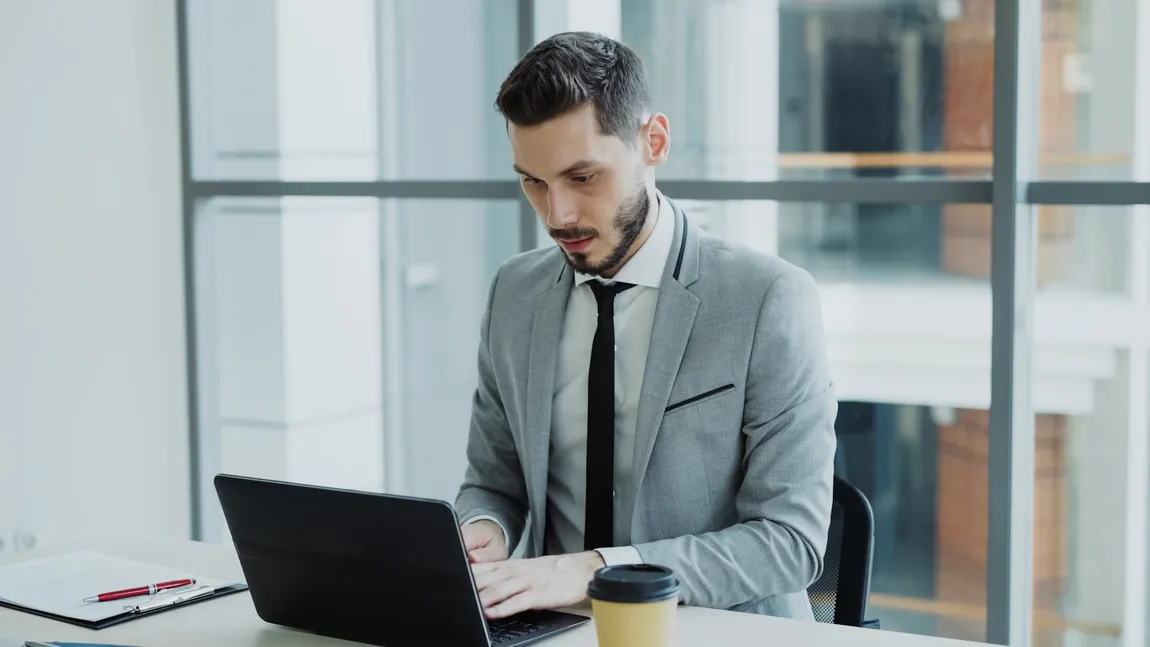 A staff member logging into a hosted Windows app from a laptop