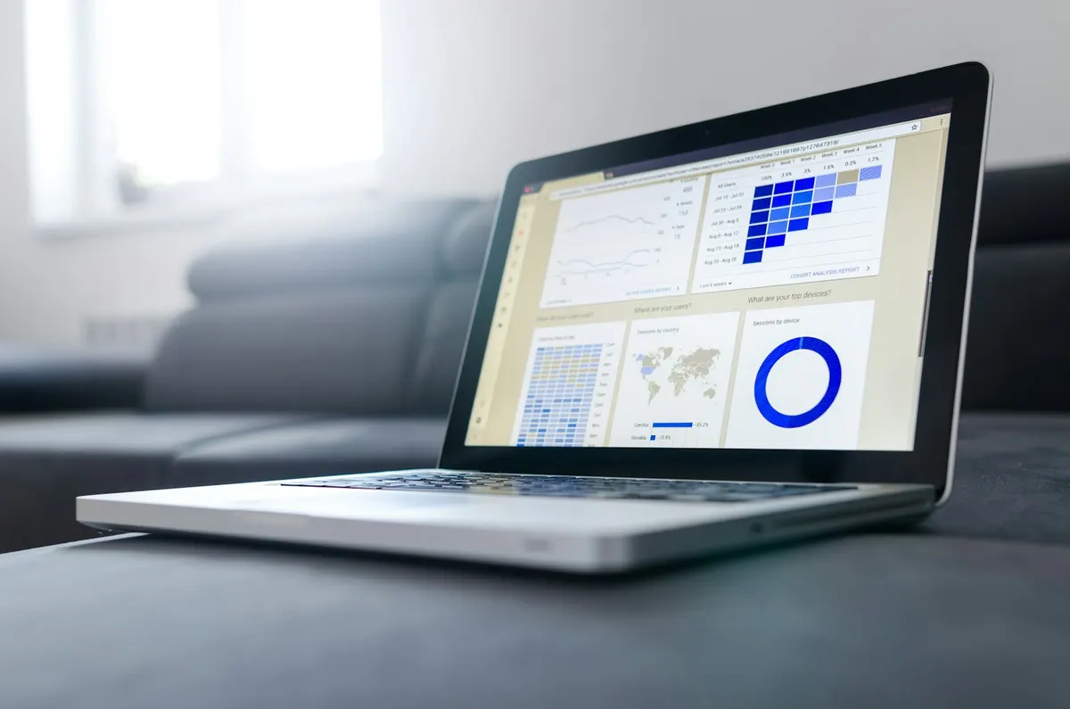 Laptop showing a dashboard of charts, the inventory work that precedes an OpenStack migration